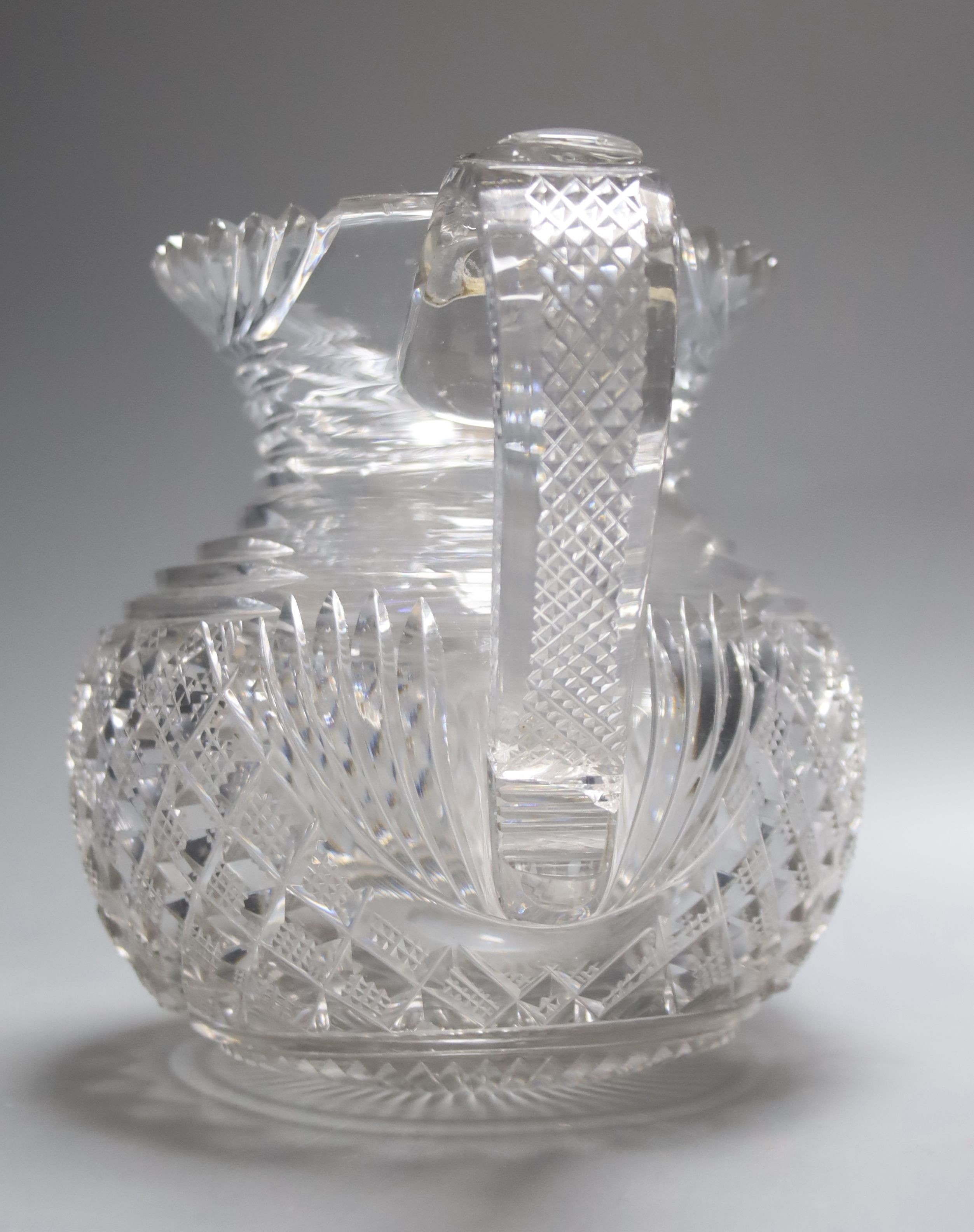 A Regency Irish Waterford crystal jug 16cm, crack to base of handle